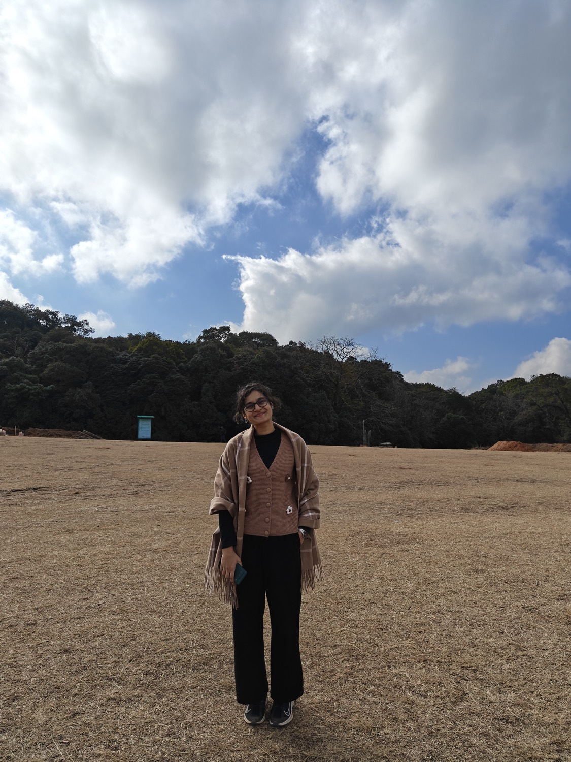 Ashita, psychotherapist, standing in an open field